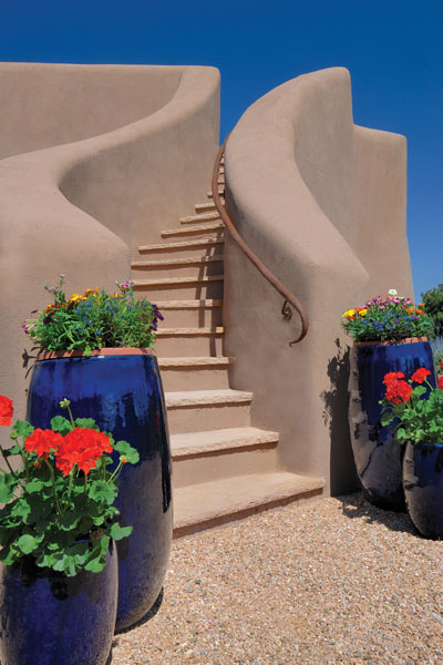 An adobe staircase winds to the rooftop where Richard, Betsy and their daughter often take in the sunset and 360-degree views of the mountains.